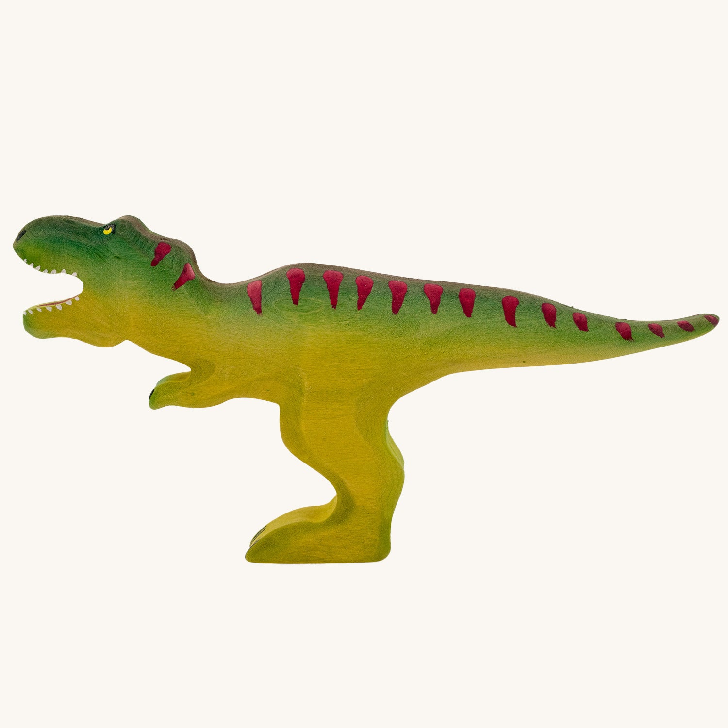 Wooden toy adult T-Rex in vibrant shades of green and purple. The T-Rex stands upright with its jaws open in a forward stance. The toy has painted teeth