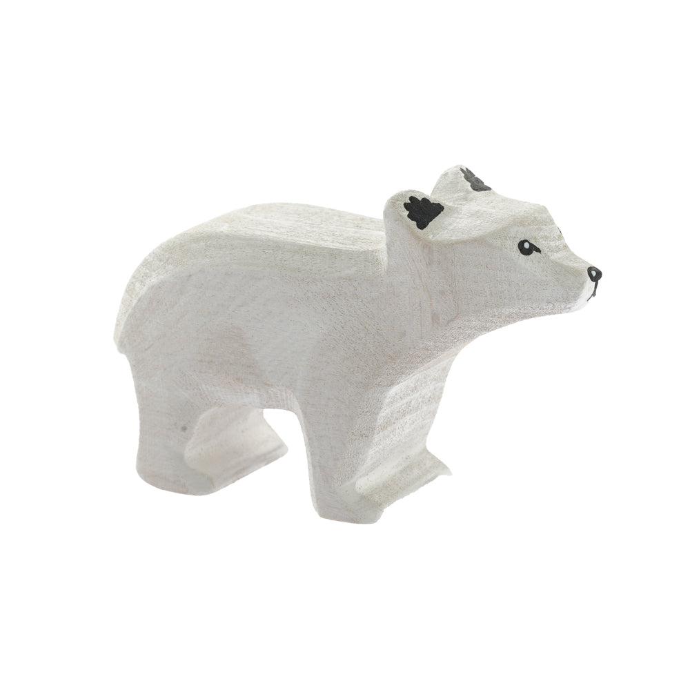 Bumbu childrens hand carved small wooden standing polar bear toy on a white background