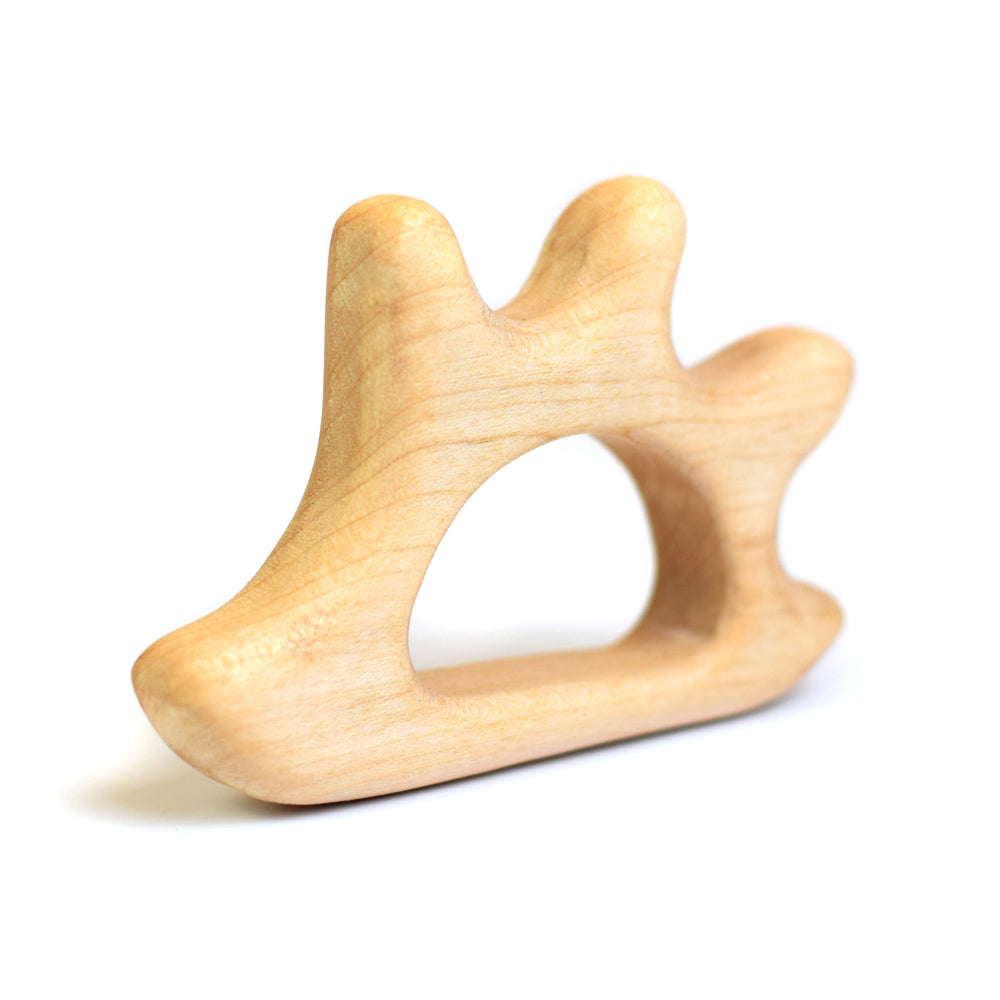 Bumbu hand carved wooden hedgehog baby teether on a white background