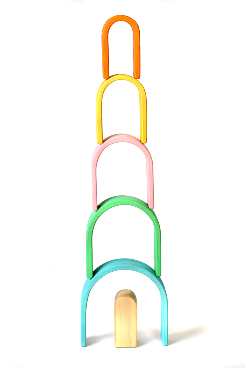 Bumbu pastel wooden arches stacked in a tower on a white background