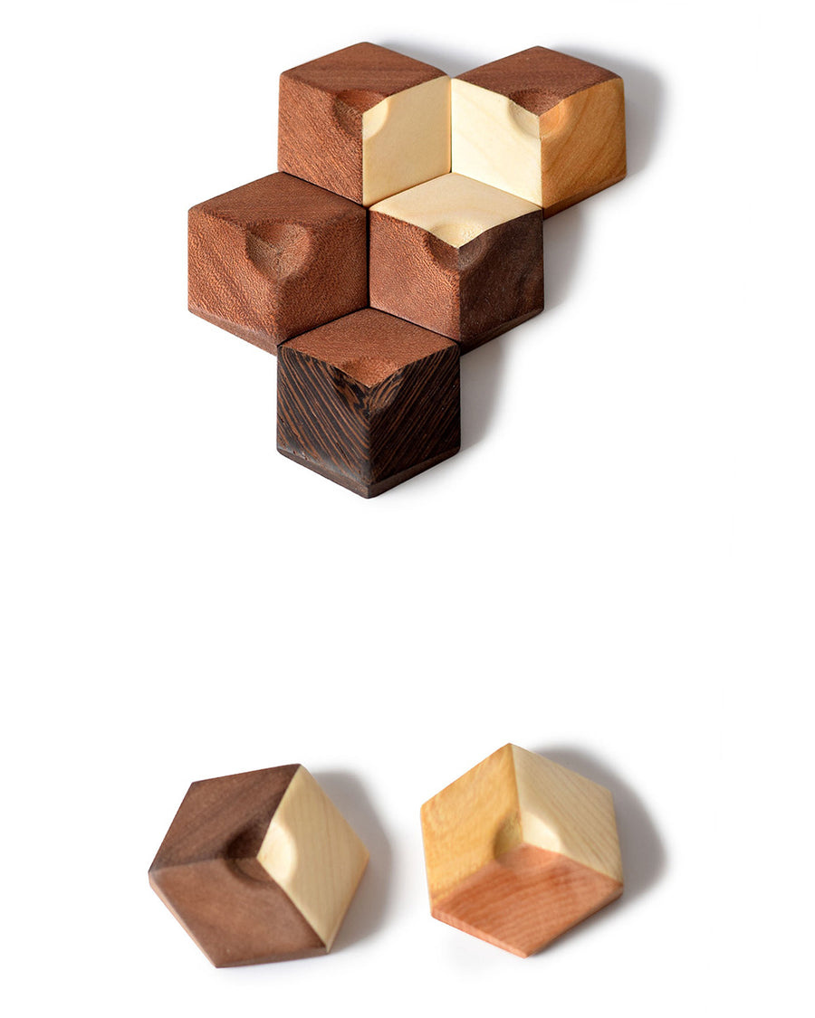 Close up of the hexagonal pieces of the Bumbu sustainable wooden connect puzzle pieces on a white background