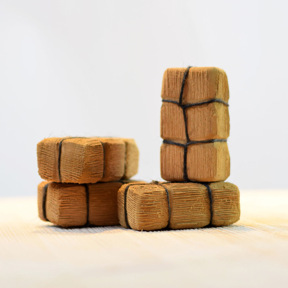 Bumbu eco-friendly childrens wooden haystack toy blocks stacked on a light wooden background