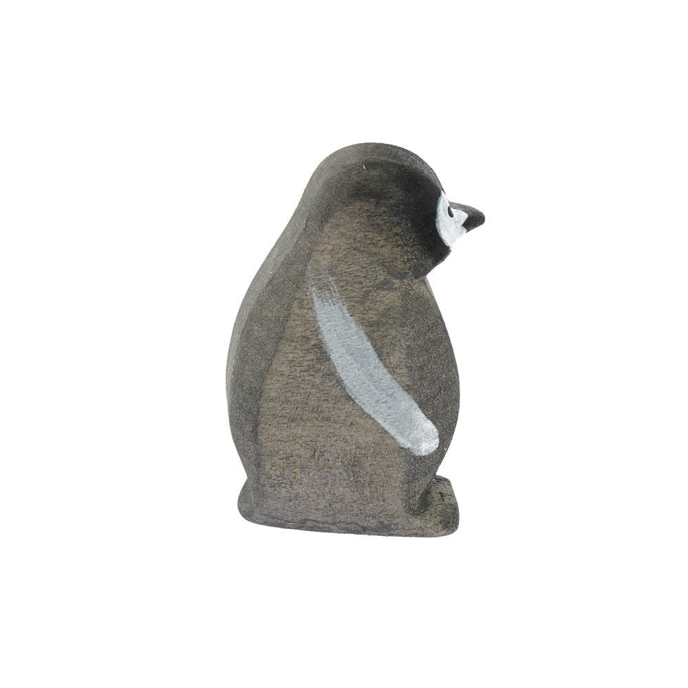 Bumbu childrens hand carved wooden penguin chick toy on a white background