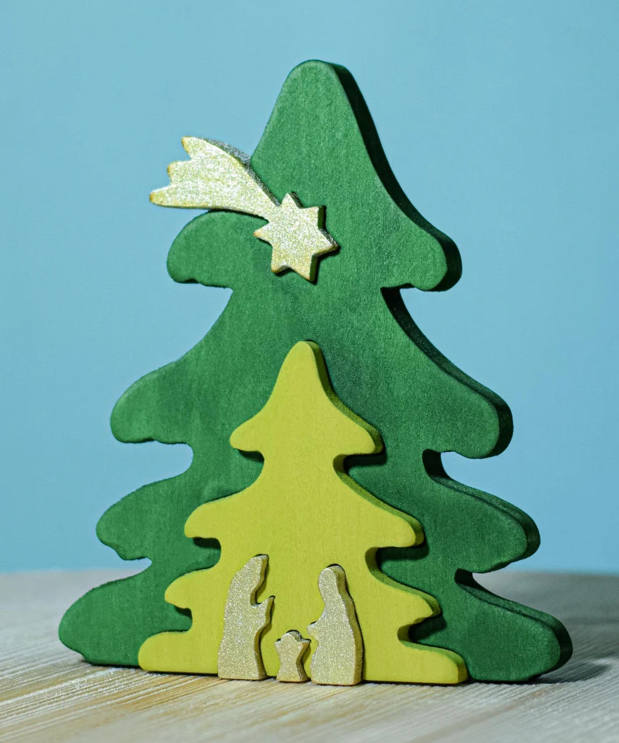 A Bumbu Christmas Tree Nativity Puzzle in the Gold colour way placed on a wooden surface. 