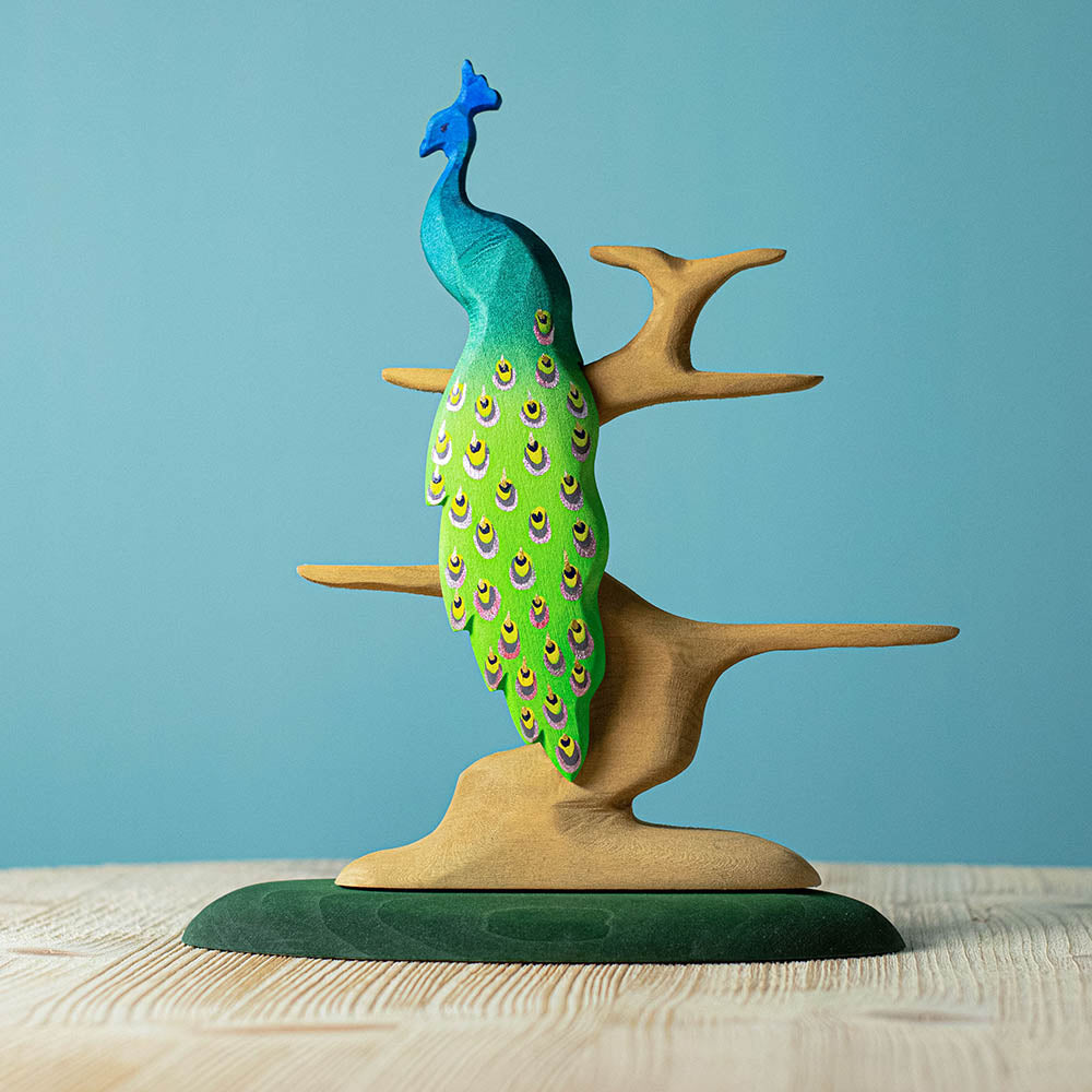 Bumbu plastic-free wooden Peacock figure balanced on top of the Bumbu bird tree