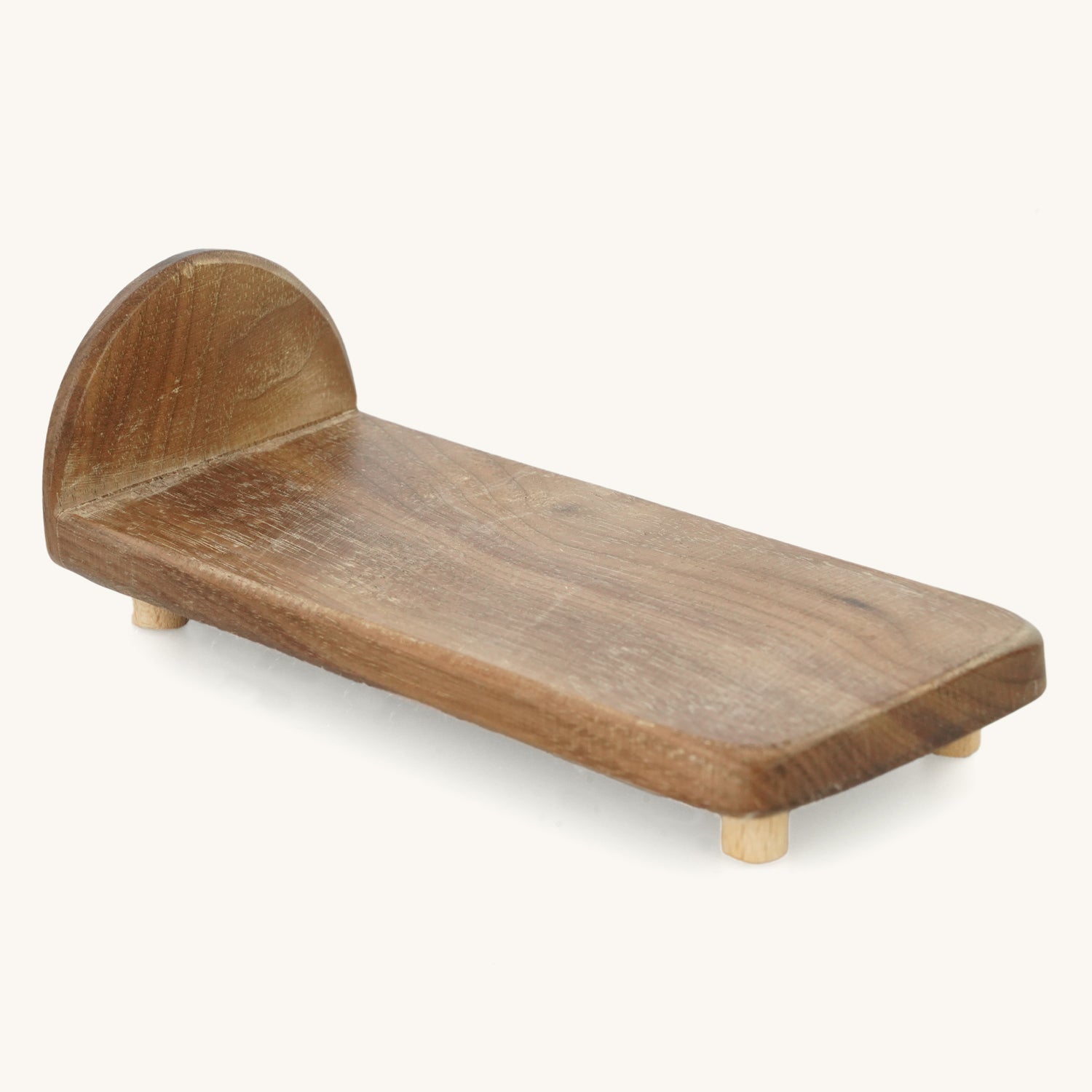 Bumbu kids miniature wooden toy bed on a beige background