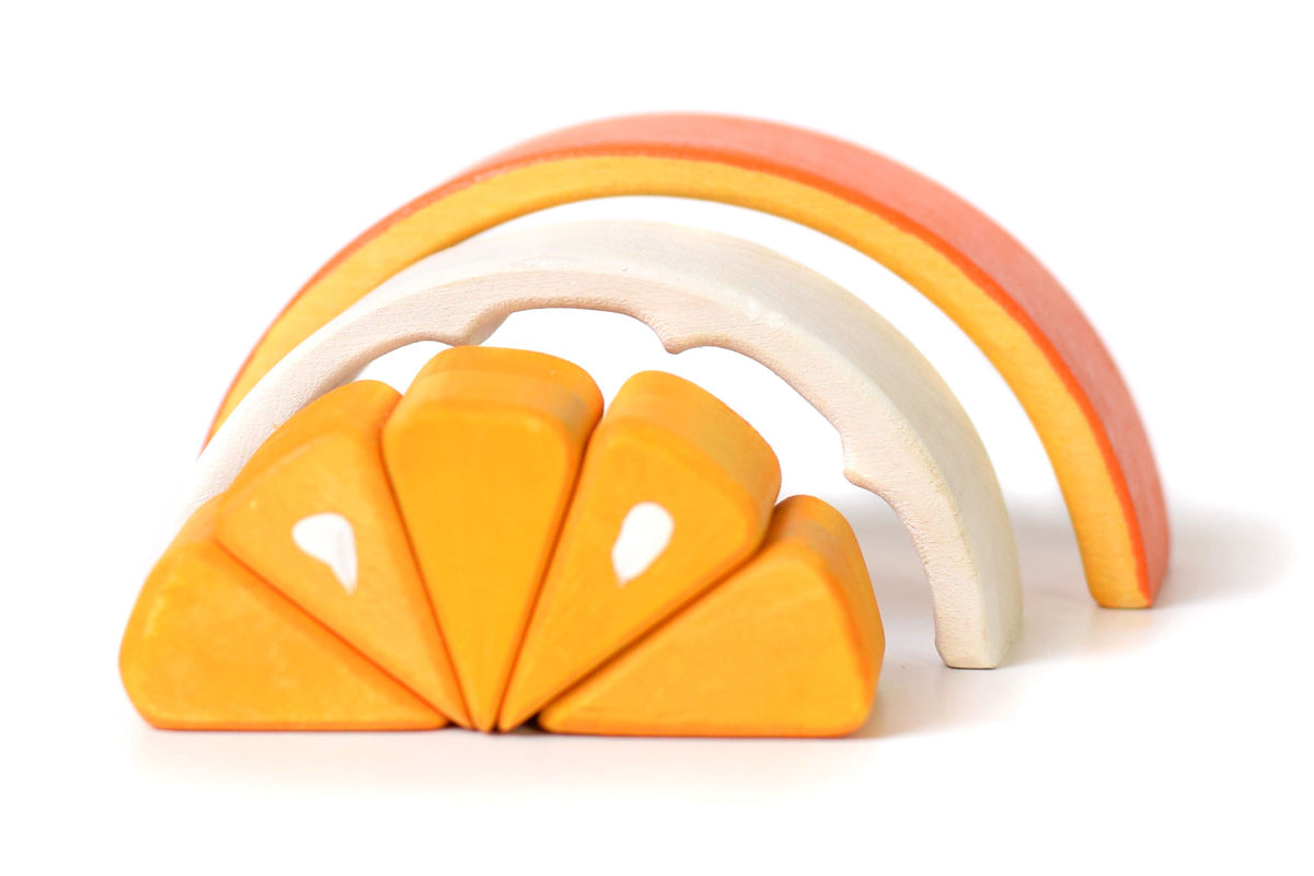 Segments of the Bumbu children's plastic free tangerine toy laid out on a white background