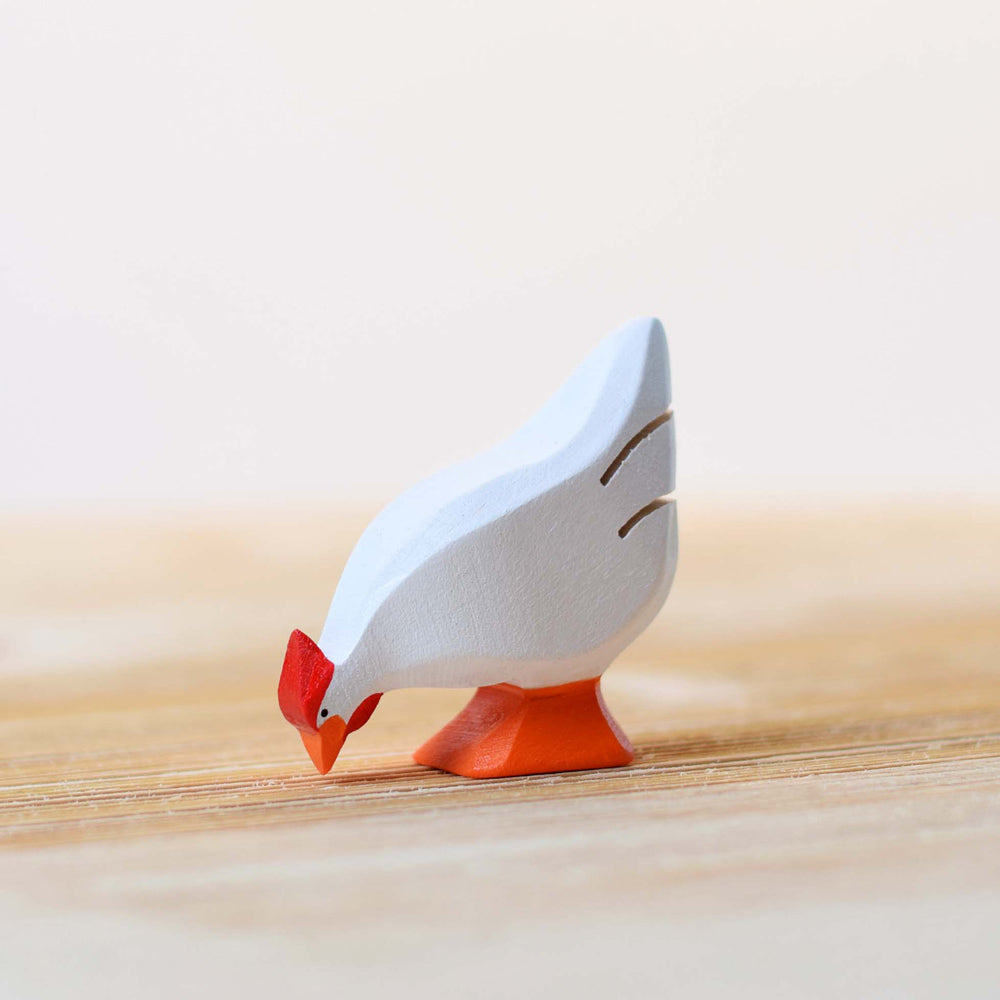 Bumbu plastic free white wooden hen toy figure stood on a wooden worktop