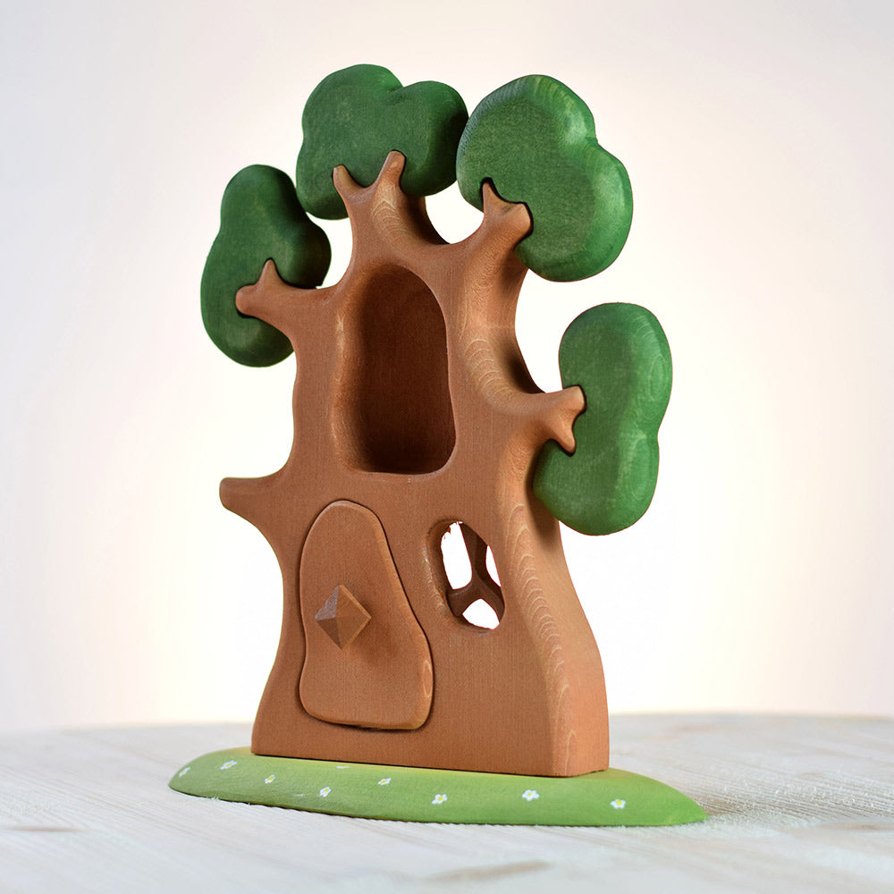 Bumbu eco-friendly wooden ancient oak tree toy on a wooden background