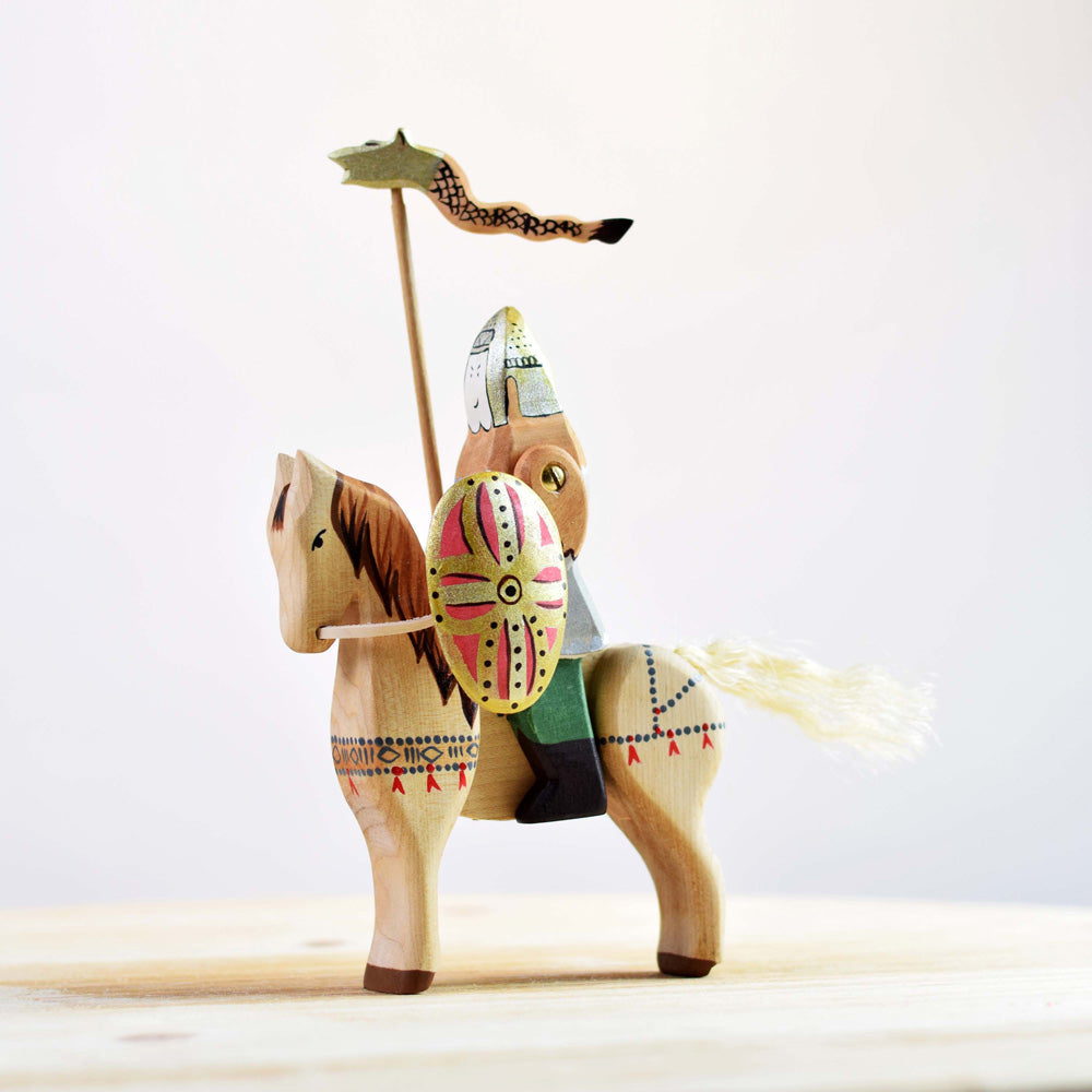 Bumbu eco-friendly wooden horse toy with a wooden knight figure sat on top