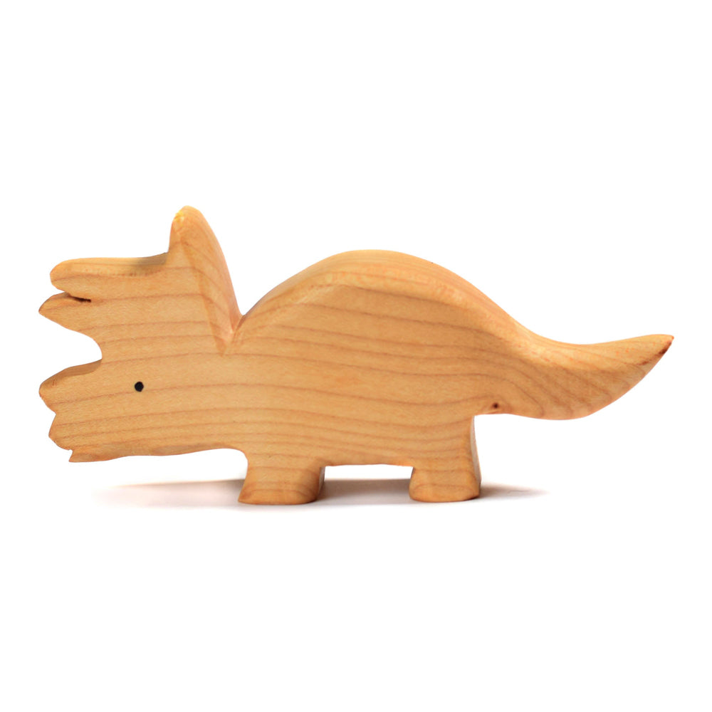 Side of the Bumbu plastic-free wooden triceratops toy on a white background