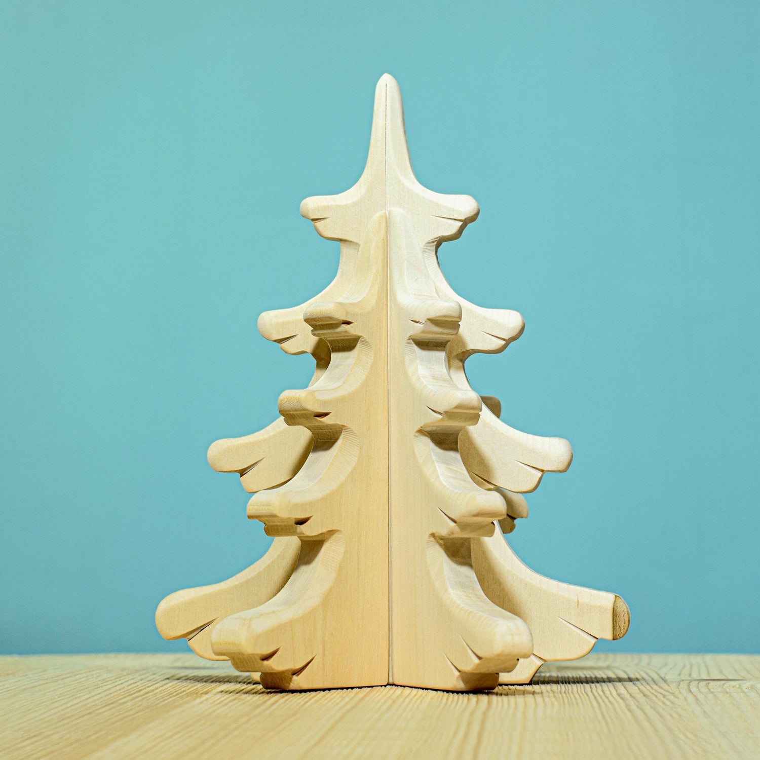 Bumbu Large Natural Sugar Pine Tree pictured on a blue background