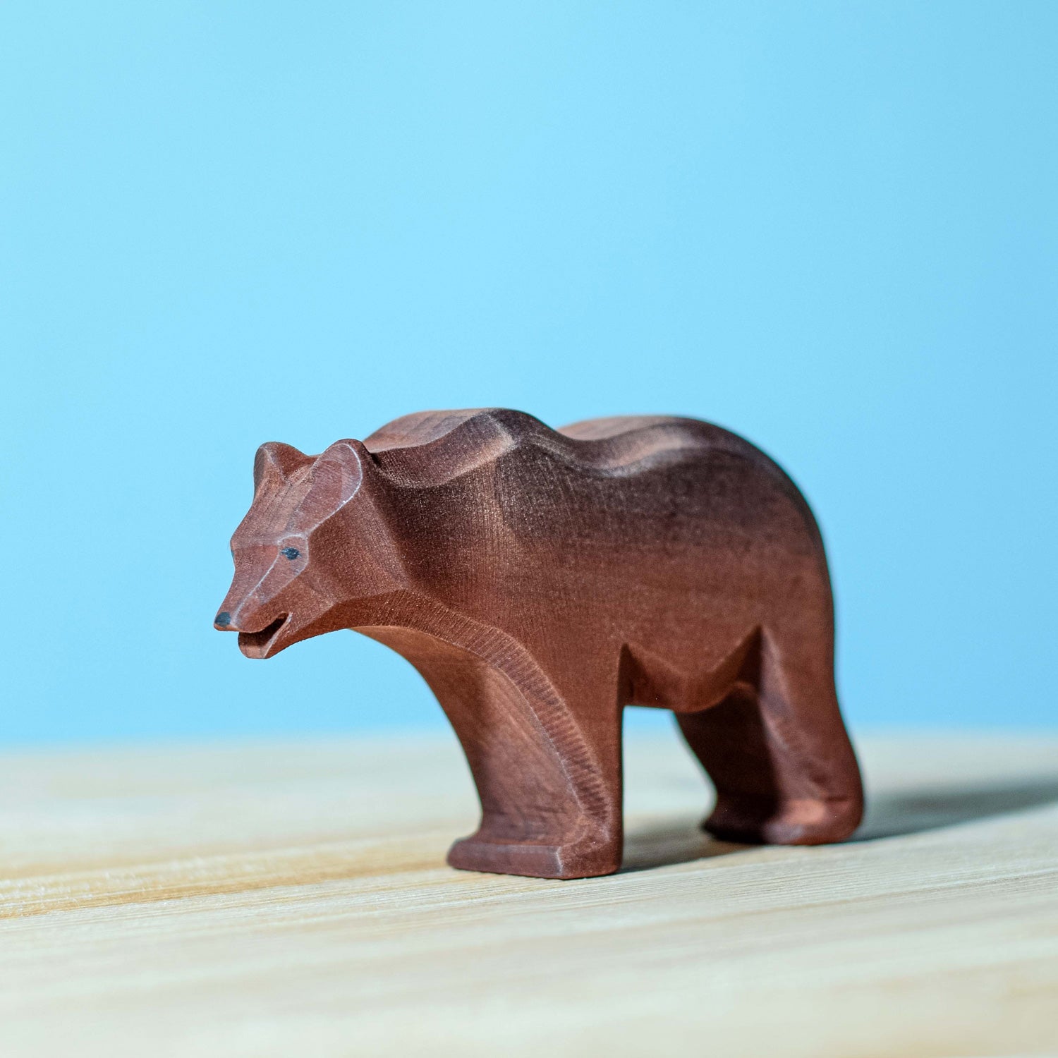 Bumbu large standing wooden bear figure on a blue background