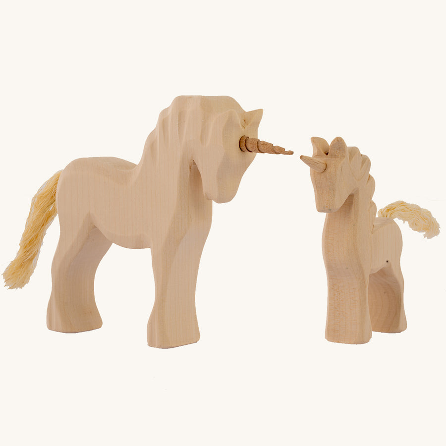 Bumbu Natural Wood Unicorn and a baby natural wood unicorn on a plain background.