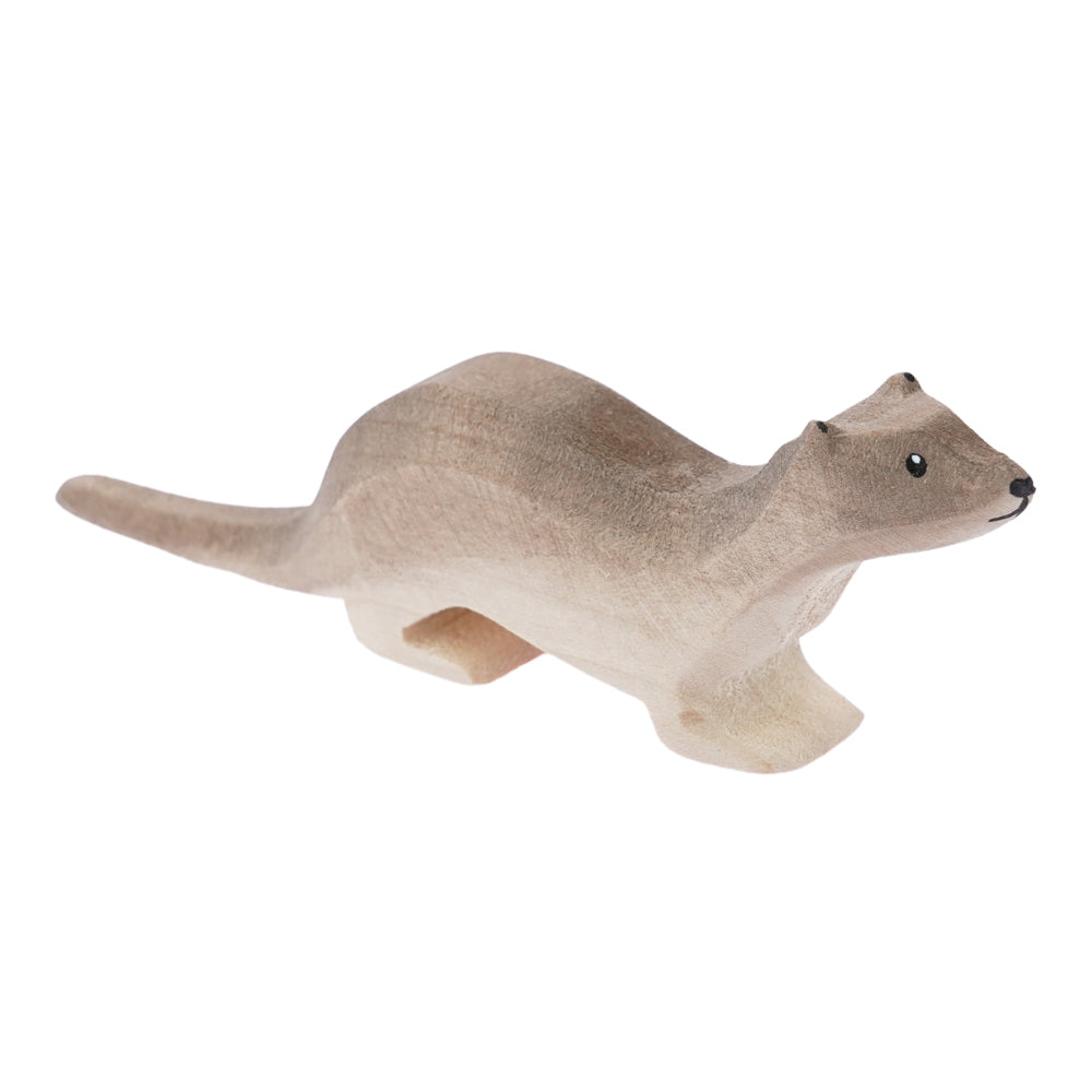 Bumbu handmade wooden otter toy figure stood on a white background