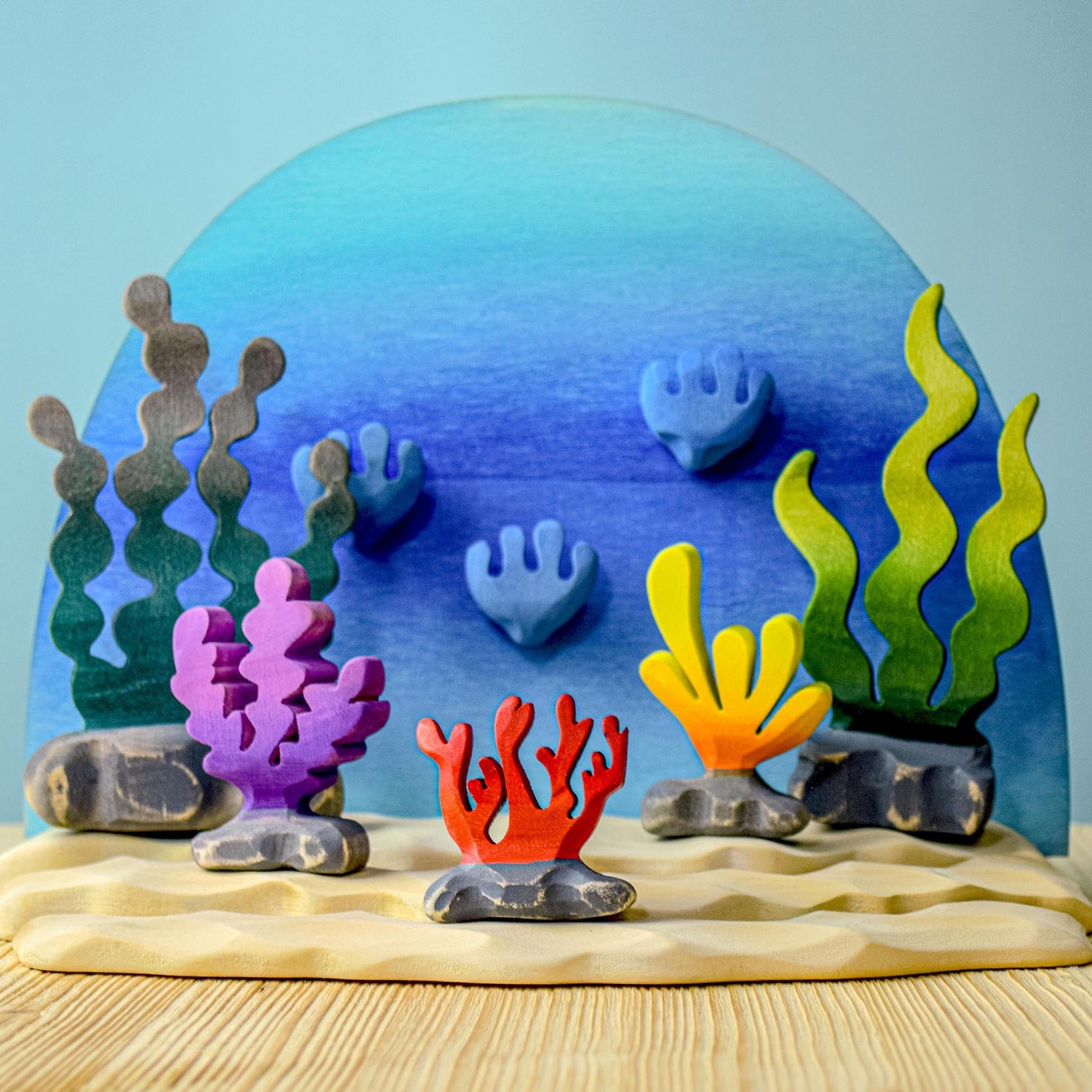 posed in an aquatic ocean scene with the Bumbu mermaid and other ocean toys.