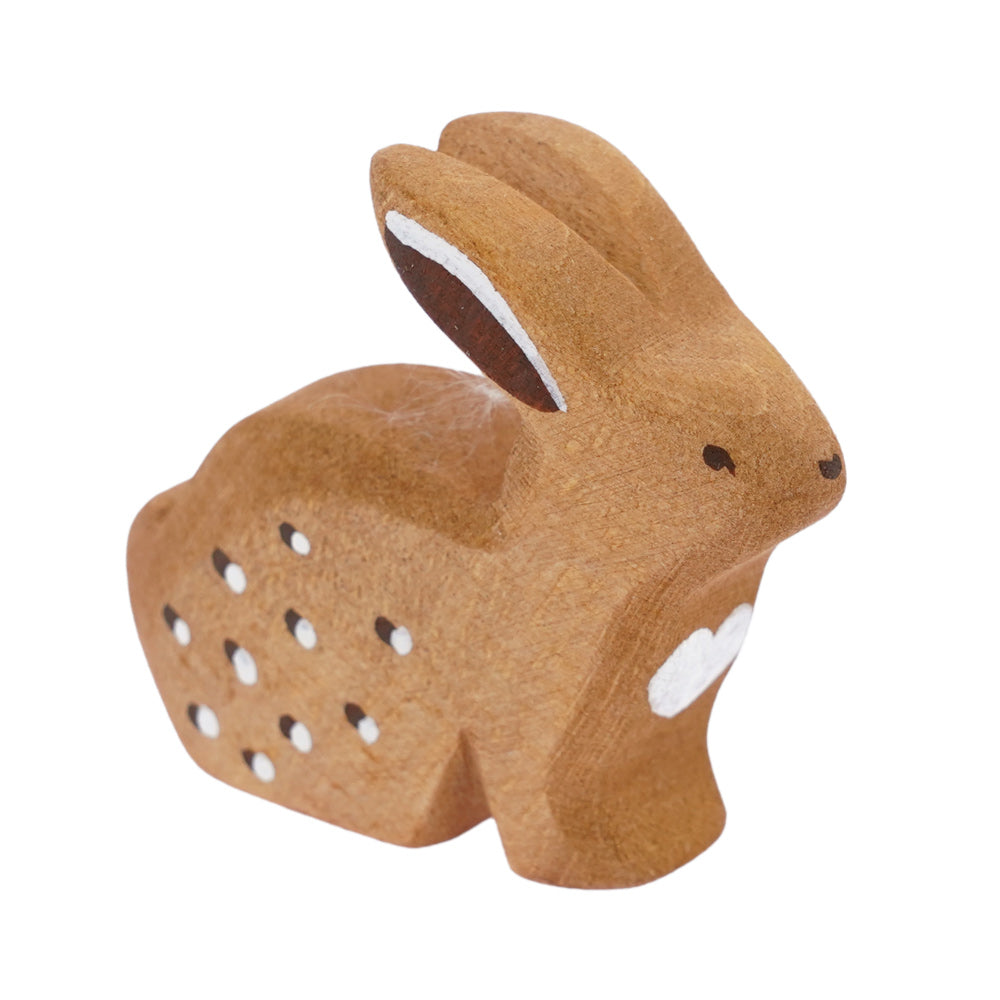 Bumbu hand carved wooden sitting rabbit toy figure on a white background