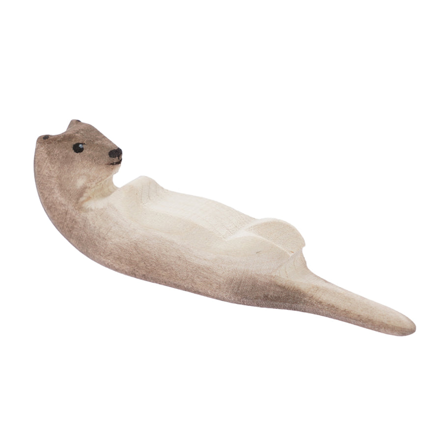 Bumbu hand carved wooden sleeping otter toy figure on a white background