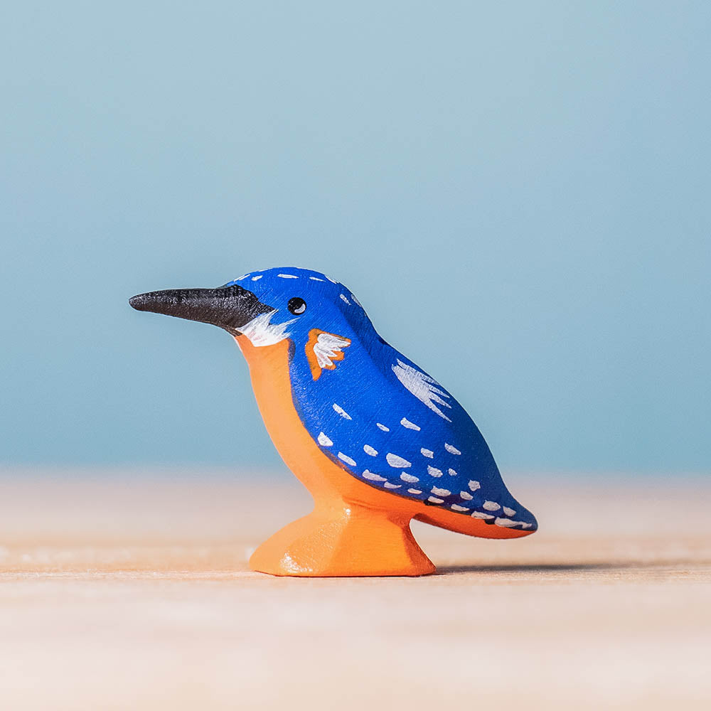 Bumbu miniature wooden kingfisher bird toy on a wooden worktop