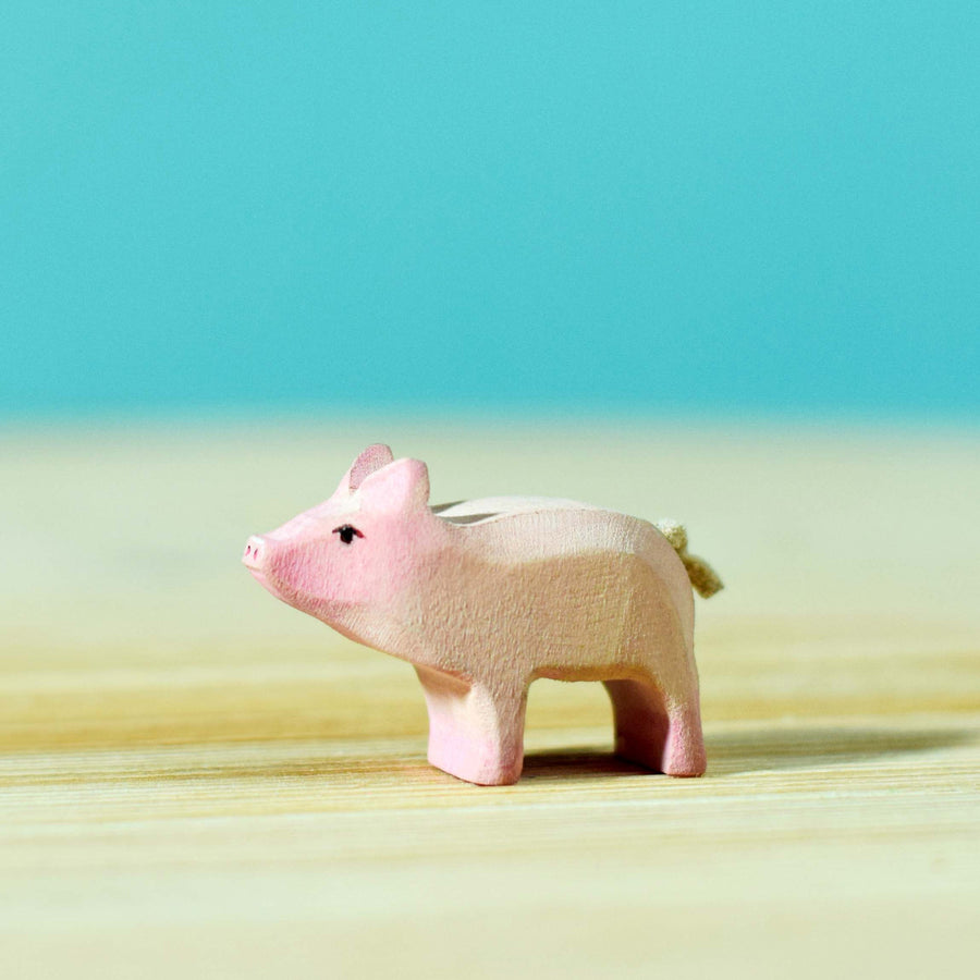 Bumbu Wooden Standing Piglet pictured on a blue background