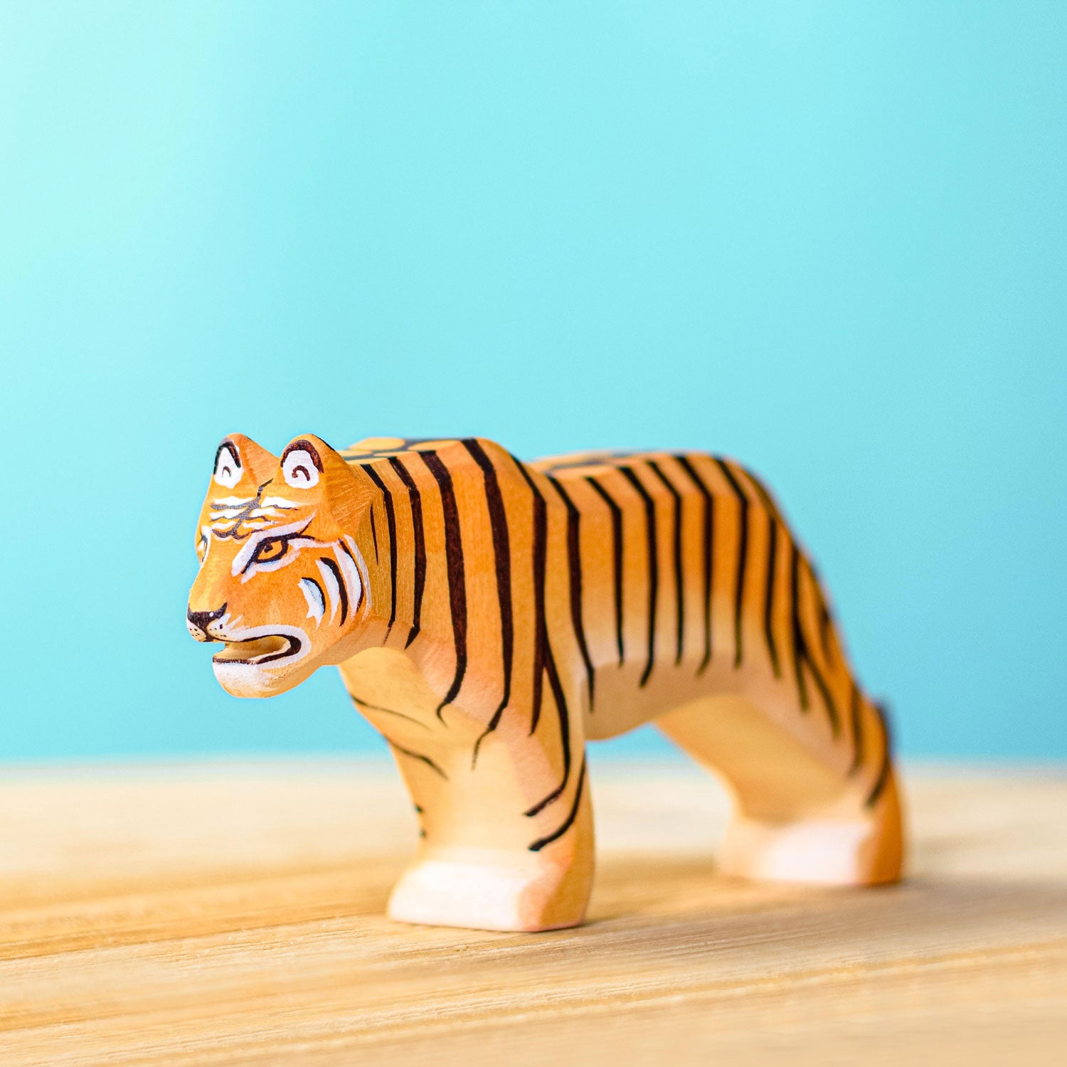 Bumbu Wooden Standing Tiger pictured on a blue background