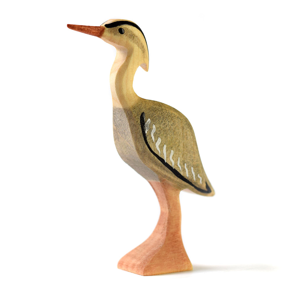 Close up of the Bumbu hand carved wooden bird figure from the Bumbu Lake and Wildlife puzzle on a white background