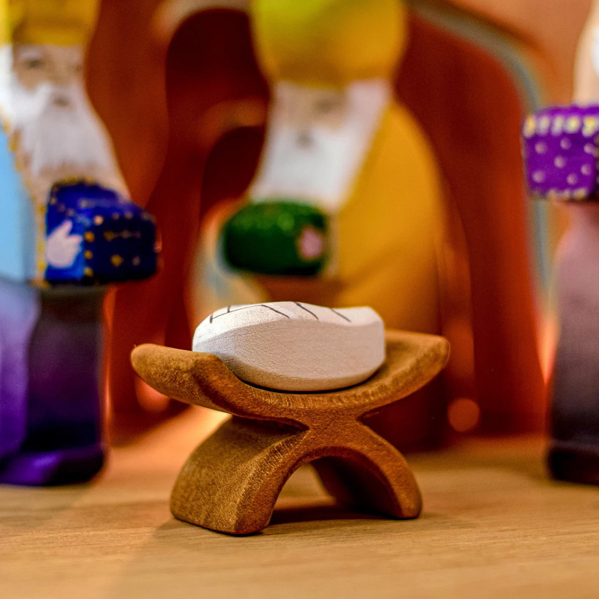 The Bumbu Baby Jesus and Crib surrounded by the Three Magi with a wooden cave in the background