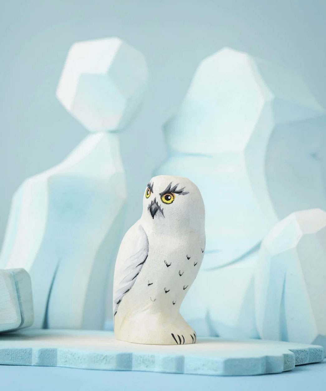 The Bumbu Toys Snowy Owl on a Bumbu ice flo in front of the Bumbu icy cliffs.