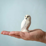 The Bumbu Toys Snowy Owl on the palm of an adult's hand. 