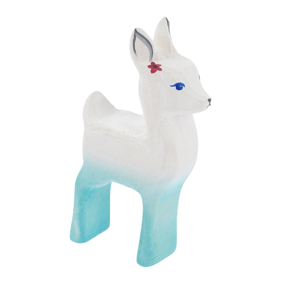 Bumbu hand carved white wooden fawn figure with flower on a white background