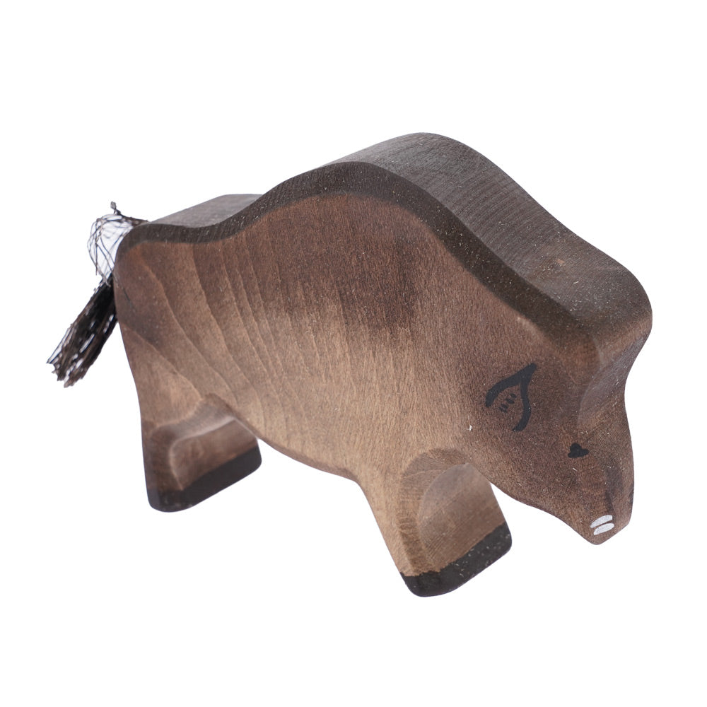 Bumbu handmade wooden wild boar toy figure stood on a white background