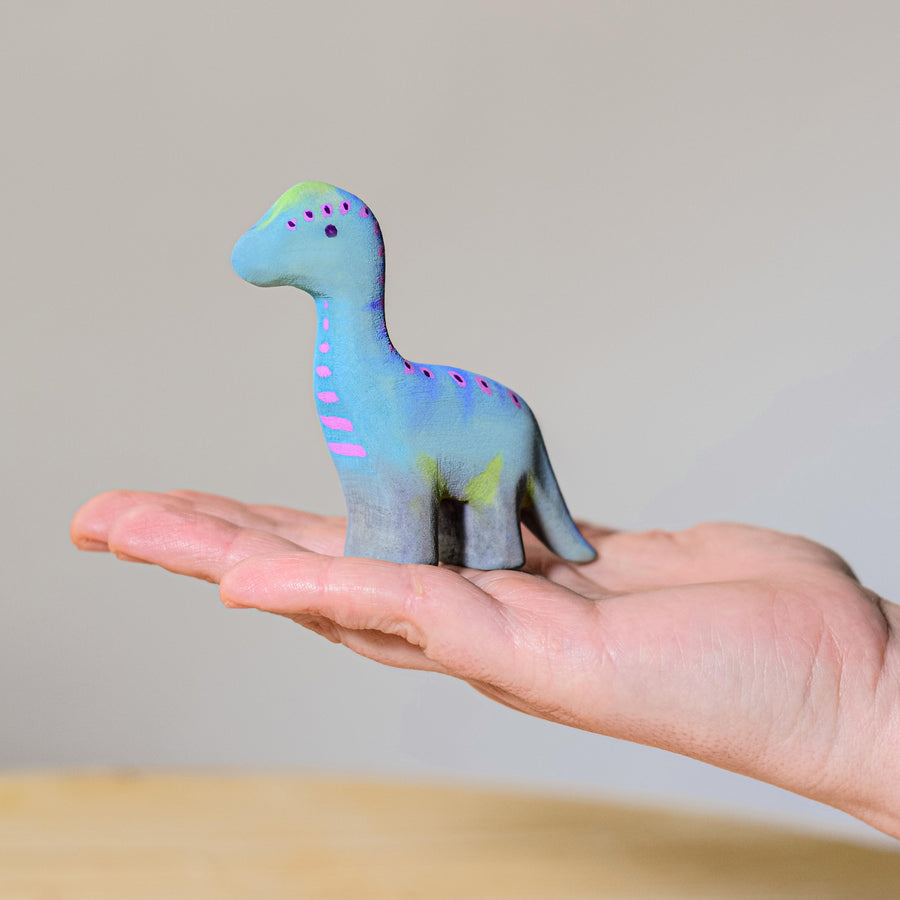 Bumbu Baby Brontosaurus pictured on a wooden surface