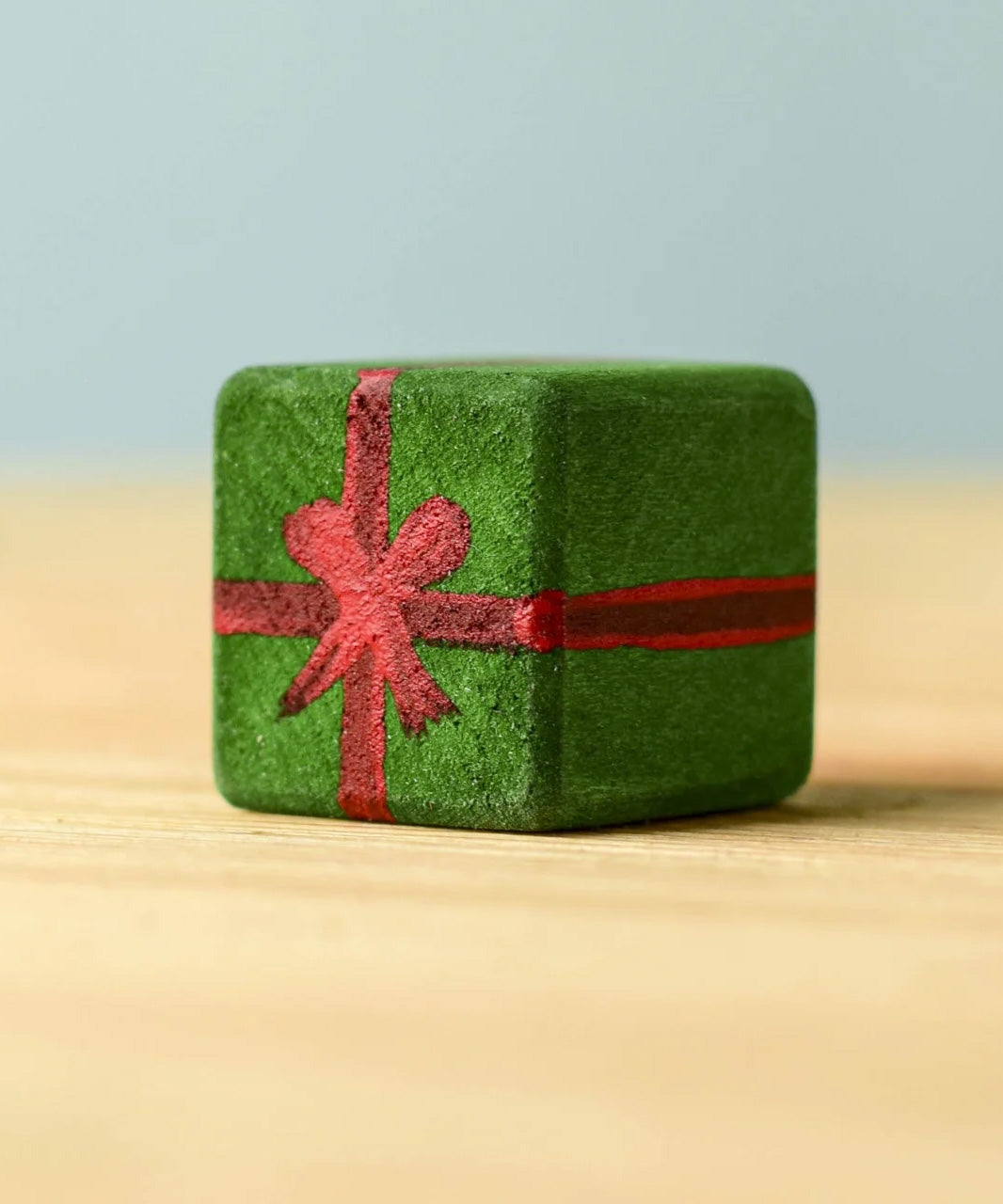 A dark green wooden Bumbu Christmas present.