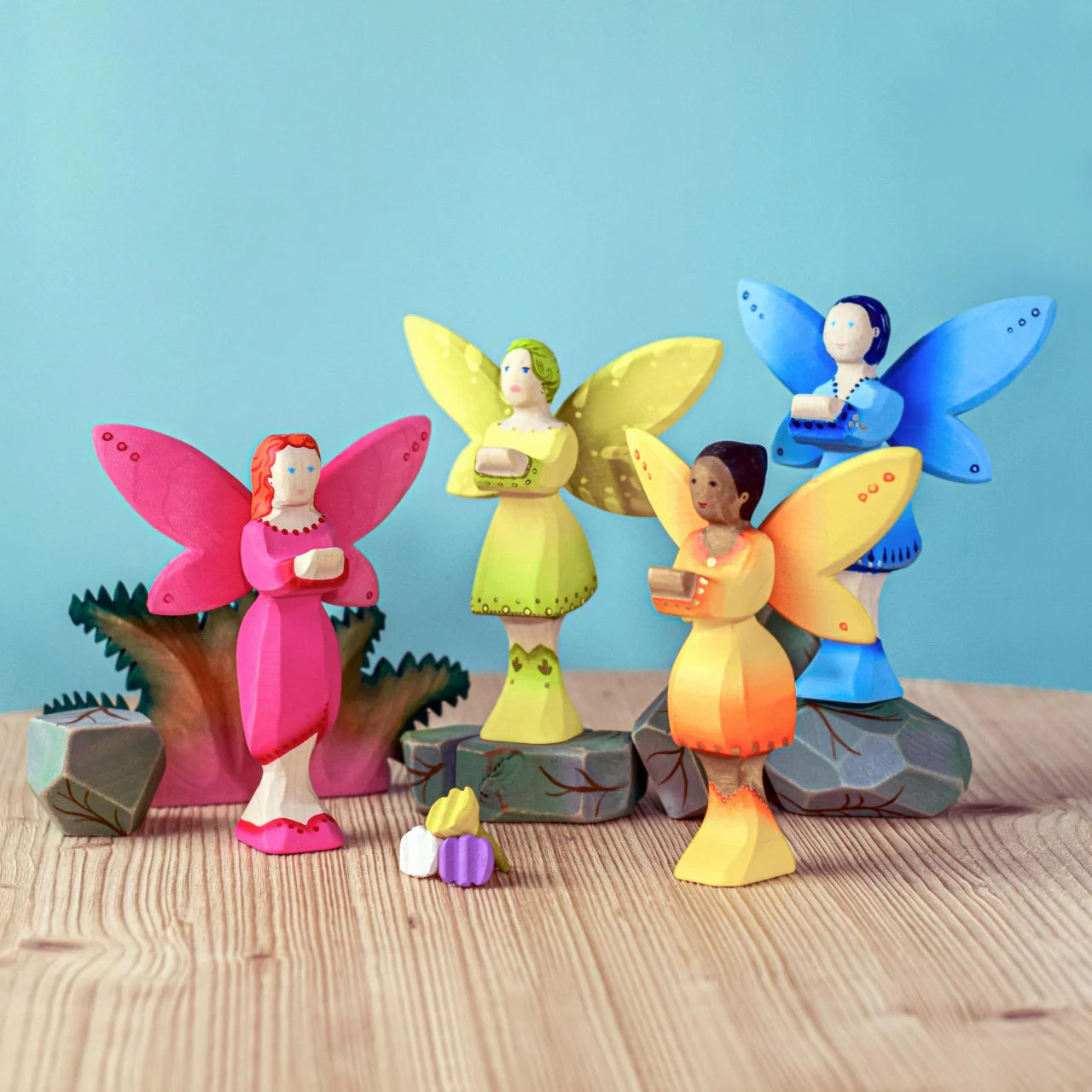 A collection of four Bumbu wooden fairies.