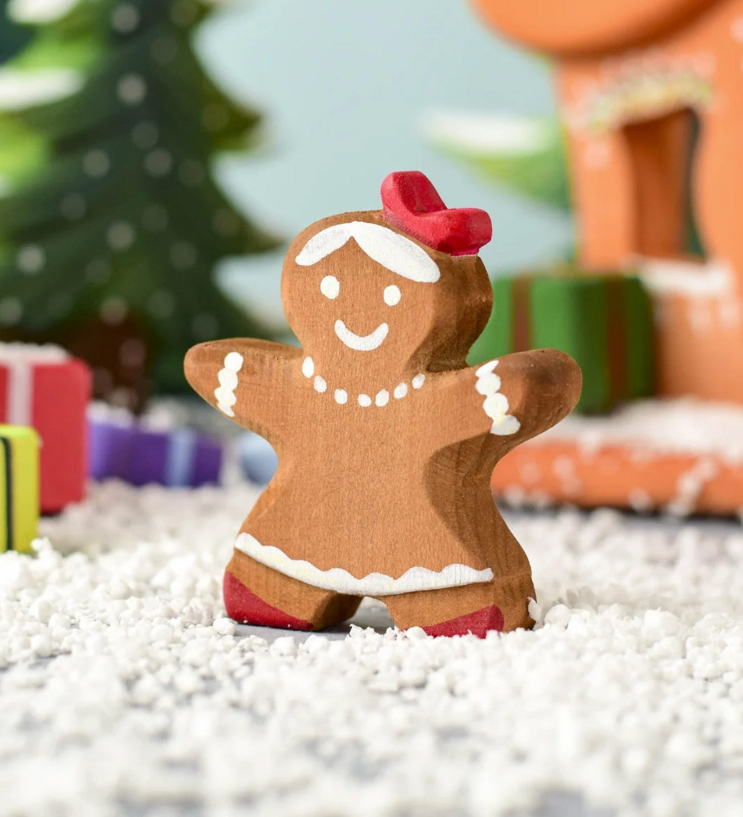 A Christmas scene including the Bumbu wooden gingerbread cookie girl