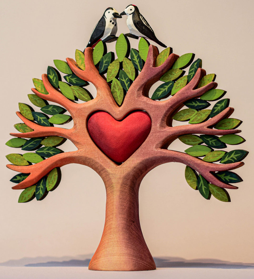 Bumbu Wooden Heart Tree. A beautifully crafted Wooden Tree with light brown branches with two Bumbu woodpecker figures sitting on top. 