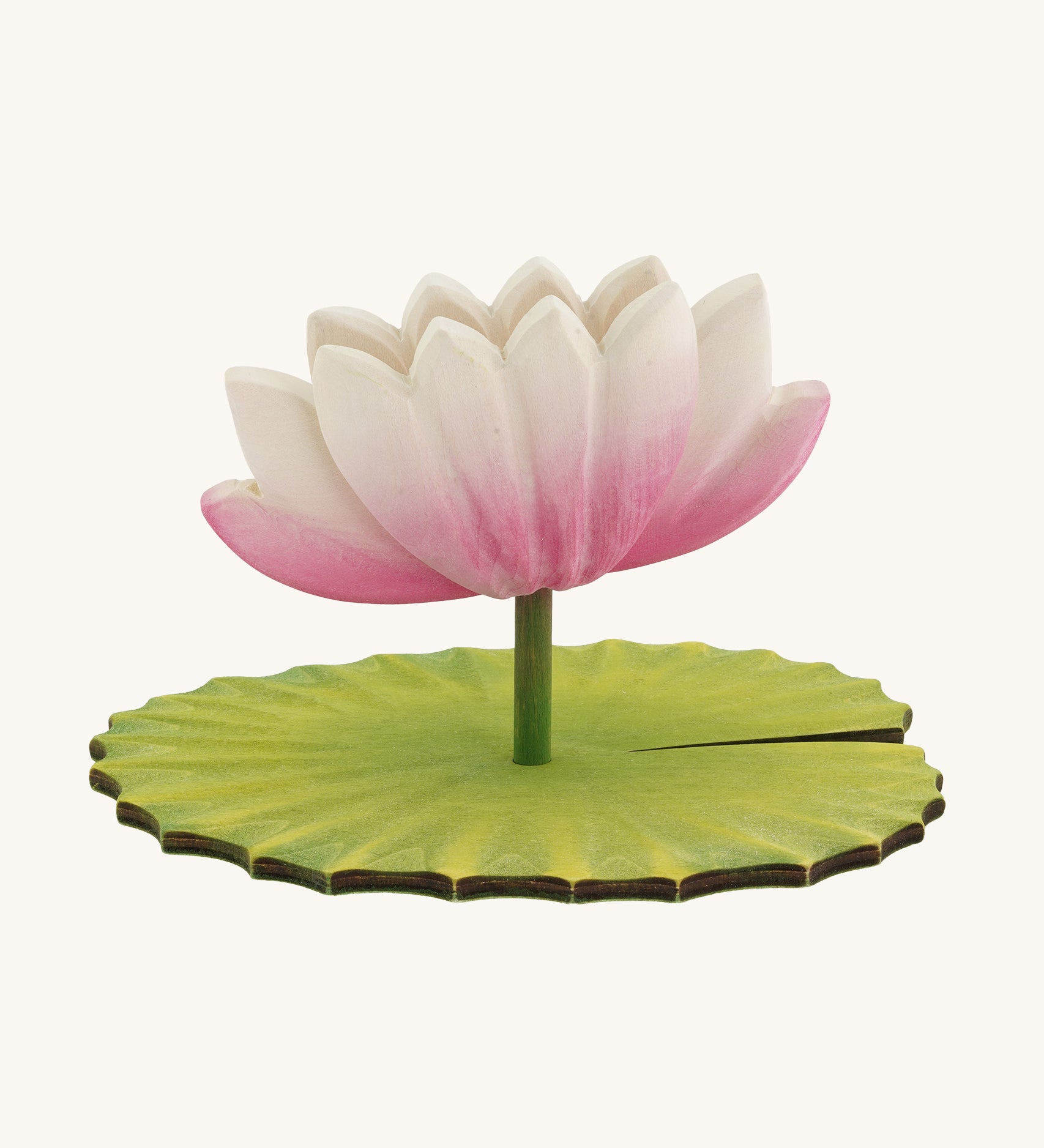 A Hand Crafted and Hand Painted Large Bumbu Wooden Lotus Flower. The figure has a pink and white Lotus Flower with a green stalk and green base, which has been handmade and hand painted, pictured on a plain background 