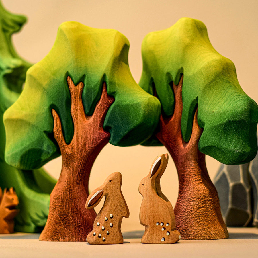 Bumbu wooden Bears frolicking in the woods and a hedgehog and a squirrel jumping between the Bumbu Oak Tree