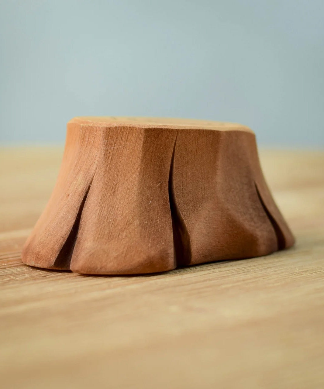 Bumbu wooden tree stump standing on a table