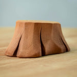 Bumbu wooden tree stump standing on a table