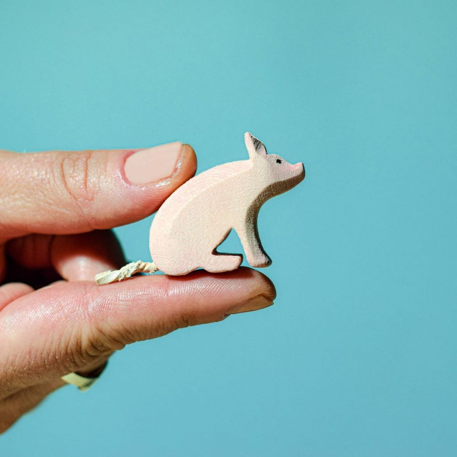 The Bumbu Sitting Piglet is a beautiful eco-friendly wooden miniature pig toy