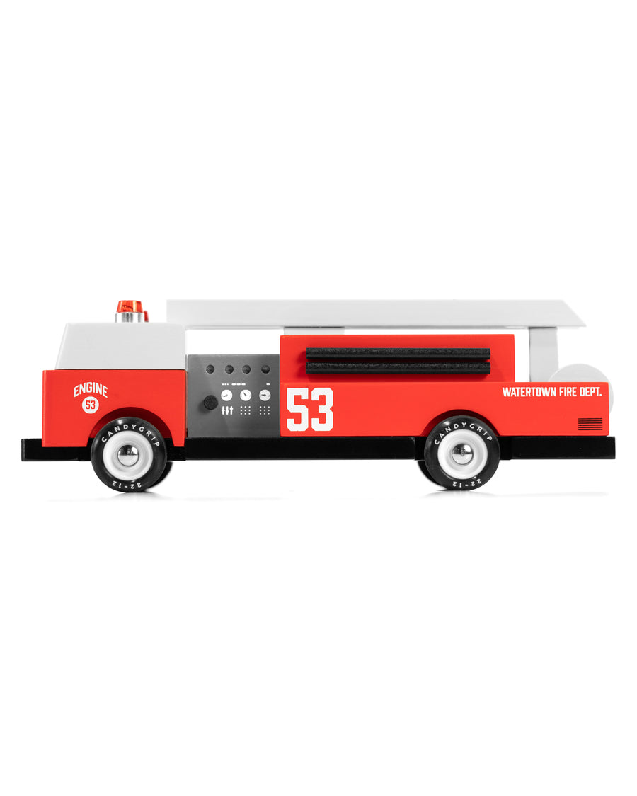 A side view of the Candylab Big Red Fire Engine pictured on a plain background