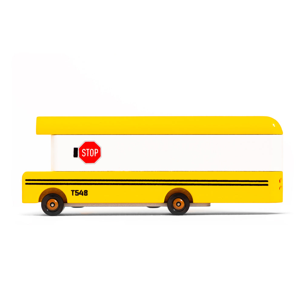 Side of the Candylab handmade wooden school bus diecast toy on a white background