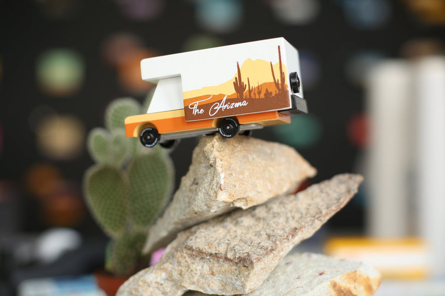 Candylab arizona campervan toy on top of a pile of large stones