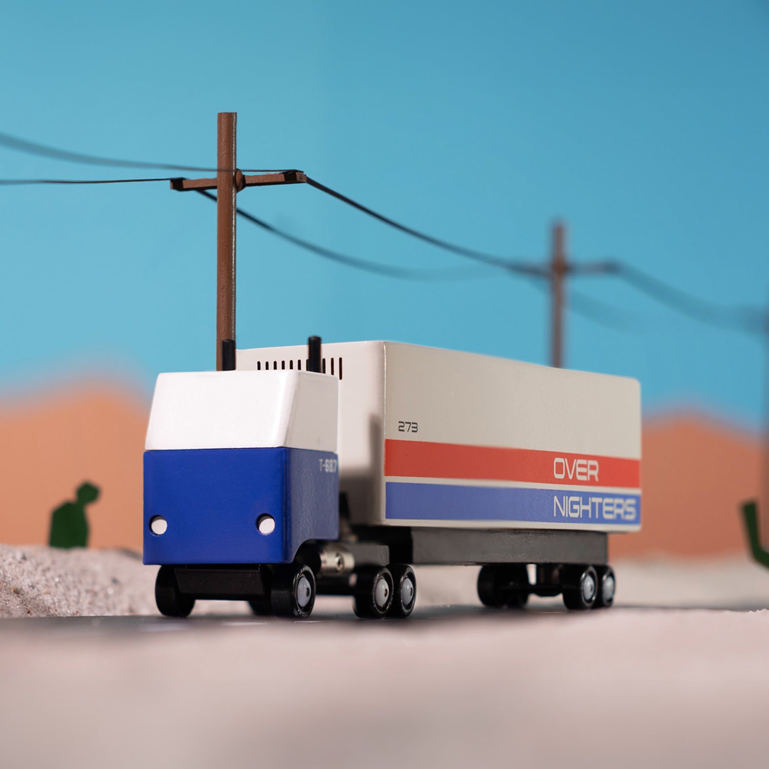 Candylab Candyvan Cargo Truck stands on a road in the desert.