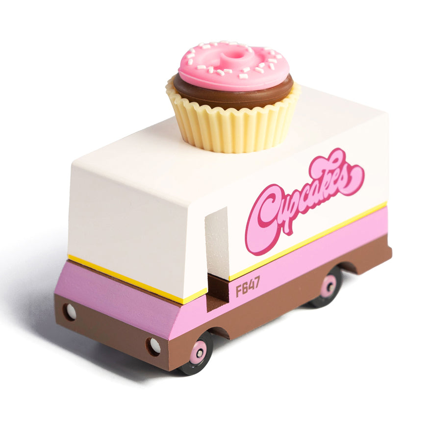 Picture of the wooden toy cupcake truck on a pink plate.