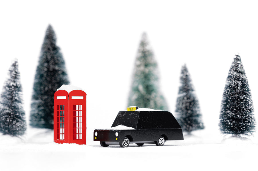 Candylab kids wooden London taxi toy car on a white background