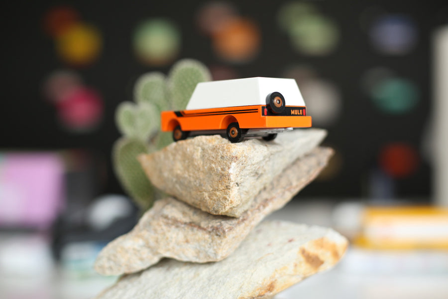 Candylab collectable childrens suv toy on a pile of large rocks