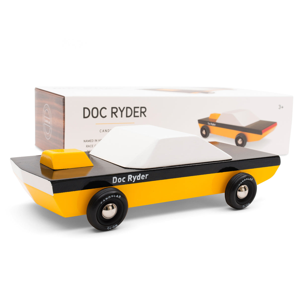 Candylab plastic-free Doc Ryder wooden car toy on a white background next to its cardboard packaging