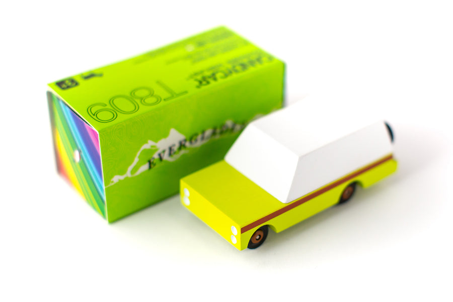 Candylab childrens green wooden car toy on a white background next to its box